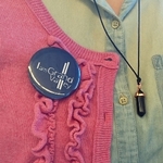 I Am Grand Valley button on a shirt